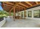 Spacious backyard covered patio with an outdoor dining area, perfect for entertaining or enjoying a quiet evening at 1140 Lake Gulch Rd, Castle Rock, CO 80104