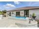 Outdoor living space features a small pool and dining area for entertaining at 1140 Lake Gulch Rd, Castle Rock, CO 80104