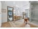 Spacious bathroom featuring double sinks, walk-in shower, soaking tub, and views of the outside at 1140 Lake Gulch Rd, Castle Rock, CO 80104