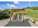 Outdoor cabana featuring seating, a barrel table, and peaceful setting for relaxation or conversation at 1140 Lake Gulch Rd, Castle Rock, CO 80104
