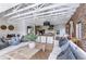 Spacious living area with a large sofa and an open layout, seamlessly connecting to the kitchen and dining areas at 1140 Lake Gulch Rd, Castle Rock, CO 80104