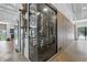 Modern wine cellar featuring glass enclosures and ample storage, perfect for showcasing and preserving wine collections at 1140 Lake Gulch Rd, Castle Rock, CO 80104