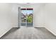 Bedroom featuring natural light, gray carpet, and sliding door to the outside at 4100 Albion St # 523, Denver, CO 80216