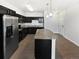 Modern kitchen featuring stainless steel appliances, granite countertops, and dark cabinetry at 4100 Albion St # 523, Denver, CO 80216