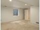 Unfinished basement space with carpet flooring and natural light at 10883 Otis Cir, Westminster, CO 80020