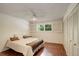 Cozy bedroom with wood floors, ample closet space, and a bright window at 10883 Otis Cir, Westminster, CO 80020