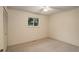 Carpeted bedroom with closet and a bright window overlooking greenery at 10883 Otis Cir, Westminster, CO 80020