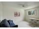 Bright bedroom with a desk, comfortable seating, and a picturesque view from the window at 10883 Otis Cir, Westminster, CO 80020