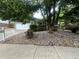 Charming single-story home featuring a well-manicured front yard with a mature shade tree and rock garden at 10883 Otis Cir, Westminster, CO 80020
