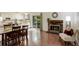 Living area with a fireplace, sliding glass doors, wood-look floors and neutral decor at 10883 Otis Cir, Westminster, CO 80020