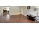 Open floor plan with a fireplace, staircase and attractive wood-look flooring at 10883 Otis Cir, Westminster, CO 80020