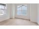 Bedroom with hardwood floors, white walls, and windows providing natural light at 5578 Inland Ave, Firestone, CO 80504