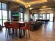 Spacious clubhouse featuring a fireplace, bar seating, and multiple seating areas at 5578 Inland Ave, Firestone, CO 80504