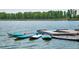View of a dock on the water with blue paddleboards ready for adventure at 5578 Inland Ave, Firestone, CO 80504