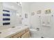 Bathroom featuring a vanity with sink, toilet, framed art, and shower with curtain at 7664 S Ivanhoe Way, Centennial, CO 80112