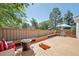 Outdoor deck showcasing seating, planters, and a fire pit perfect for entertaining and relaxation at 7664 S Ivanhoe Way, Centennial, CO 80112
