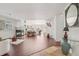 Open concept living room boasts hardwood floors, fireplace, and natural light at 7664 S Ivanhoe Way, Centennial, CO 80112