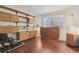 Office with wooden built-ins, hardwood floors and a window at 7664 S Ivanhoe Way, Centennial, CO 80112