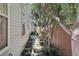 Side yard with exterior access and lush green landscaping at 7664 S Ivanhoe Way, Centennial, CO 80112