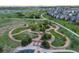 Scenic aerial view of a community park featuring walking paths, gazebos, and lush greenery at 1315 Sidewinder Cir, Castle Rock, CO 80108