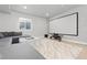 Basement space features a comfortable seating area, large screen, and modern decor, great for movie nights at 1315 Sidewinder Cir, Castle Rock, CO 80108