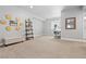 Bright and spacious basement area featuring a desk area with natural light, decorative wood décor, and a comfortable bench at 1315 Sidewinder Cir, Castle Rock, CO 80108