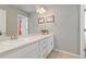 Bathroom featuring double sinks and bright vanity at 1315 Sidewinder Cir, Castle Rock, CO 80108