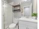 Bathroom features a modern glass shower, sleek vanity, and decorative shelving, providing a spa-like experience at 1315 Sidewinder Cir, Castle Rock, CO 80108