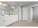 Large bathroom featuring double sinks, white cabinets, and a glass shower at 1315 Sidewinder Cir, Castle Rock, CO 80108
