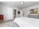 Neutral bedroom with white bed, gray dresser and carpet at 1315 Sidewinder Cir, Castle Rock, CO 80108