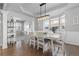 Stylish dining room features wood floors, coffered ceiling, and large windows at 1315 Sidewinder Cir, Castle Rock, CO 80108