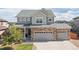 Charming two-story home with brick accents, gray siding, and a well-maintained lawn at 1315 Sidewinder Cir, Castle Rock, CO 80108