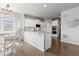 Stylish kitchen with white cabinets, an island with seating, and stainless steel appliances at 1315 Sidewinder Cir, Castle Rock, CO 80108