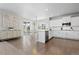 Bright kitchen with white cabinets, stainless steel appliances, and a dining area at 1315 Sidewinder Cir, Castle Rock, CO 80108
