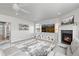 Open living room showcasing a fireplace, built-in shelving, and a comfortable gray sectional at 1315 Sidewinder Cir, Castle Rock, CO 80108