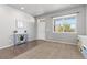 Neutral living room with light grey walls, a window, and a small table at 1315 Sidewinder Cir, Castle Rock, CO 80108