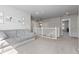 Upstairs loft featuring plush carpeting, a cozy sofa, and white railings at 1315 Sidewinder Cir, Castle Rock, CO 80108
