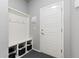 Mudroom features built-in storage, coat hooks, and a sleek design, offering organization and functionality at 1315 Sidewinder Cir, Castle Rock, CO 80108