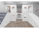 Bright playroom featuring climbing stairs, a built-in play structure, neutral carpet, and white walls with themed decorations at 1315 Sidewinder Cir, Castle Rock, CO 80108