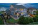 Spacious two-story home with a large backyard, featuring a patio, playset, lush lawn, and beautiful landscaping at 1315 Sidewinder Cir, Castle Rock, CO 80108