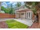 Backyard featuring a pergola, string lights, and grass at 3322 W 26Th Ave, Denver, CO 80211
