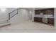 Finished basement area featuring neutral carpeting and a wet bar at 3322 W 26Th Ave, Denver, CO 80211