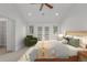 Cozy bedroom featuring french doors, neutral decor, and plush bedding for a relaxing retreat at 3322 W 26Th Ave, Denver, CO 80211