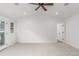 Spacious bedroom with ceiling fan and door to patio at 3322 W 26Th Ave, Denver, CO 80211