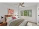Serene bedroom featuring ample natural light, a ceiling fan, and minimalist decor for a restful ambiance at 3322 W 26Th Ave, Denver, CO 80211
