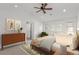 Bright bedroom with a walk-out balcony, modern artwork, and a calm, inviting interior design at 3322 W 26Th Ave, Denver, CO 80211