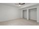 Neutral bedroom featuring carpeted floors, recessed lighting, a ceiling fan, and double closets with clothing racks at 3322 W 26Th Ave, Denver, CO 80211