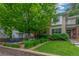 Attractive home with a well-manicured lawn, lush landscaping, and a large tree providing shade and beauty at 3322 W 26Th Ave, Denver, CO 80211