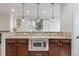 Kitchen features granite countertops and stainless steel microwave at 3322 W 26Th Ave, Denver, CO 80211