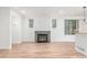 Comfortable living area with a cozy fireplace, and great natural light for relaxing and entertaining guests at 3322 W 26Th Ave, Denver, CO 80211